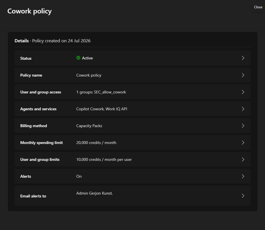 Cowork policy configuration showing Active status, User and group access scoped to SEC_allow_cowork, Copilot Cowork and Work IQ API as the covered services, Capacity Packs billing, a 20,000 credits/month tenant limit, a 10,000 credits/month per-user limit, and alerts enabled